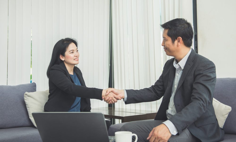 Negotiating business,Image businesswomen handshake,happy with work,business woman she is enjoying with her workmate,Handshake Gesturing People Connection Deal Concept.