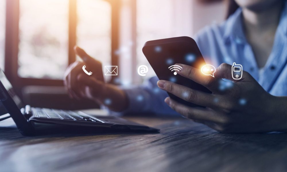 Contact us or Customer support hotline people connect. Businessman using a laptop and touching on virtual screen contact icons email, address, live chat, internet wifi.